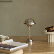 Crystal Flowerpot rechargeable table lamp lit on a set dining table