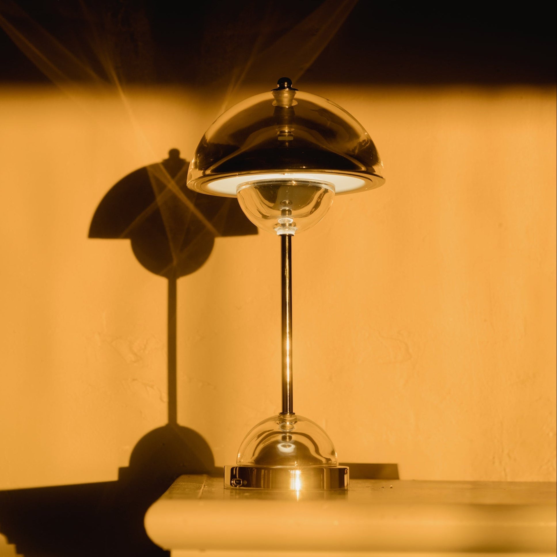 Clear Crystal Flowerpot touch lamp switched on, close up