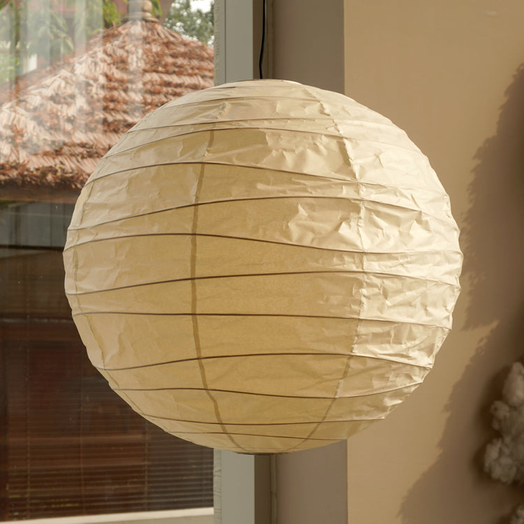 Hüga Collective Akari handmade paper ceiling lamp with natural sunlight. In common space.