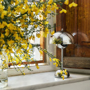 Metallic Flowerpot cordless table lamp beside yellow flowers